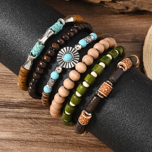 Bohemian multi-layer wooden bead bracelet set with turquoise accents and ethnic charms