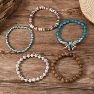 Bohemian beaded bracelet set with turquoise beads, wooden beads and bow charm