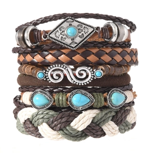 Bohemian multi-layer braided leather bracelet with turquoise stones and ethnic metal charms