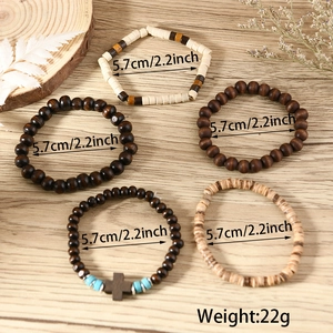 Detail view of 5-piece wood bead bracelet set with turquoise accents and cross charm
