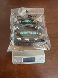Weight measurement of bohemian leather bracelet set with turquoise beads on a scale