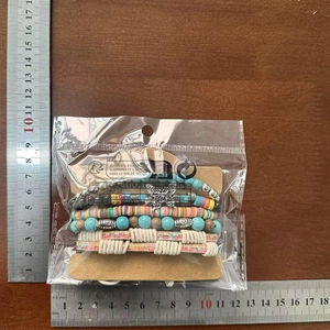 Detailed view of Bohemian layered bracelets with turquoise beads and size measurements