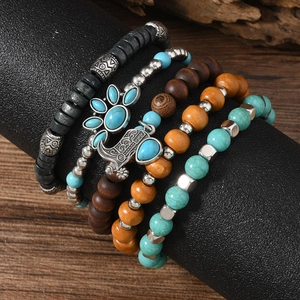 Bohemian multilayer beaded bracelet set with wood beads and vintage boot pendant charm
