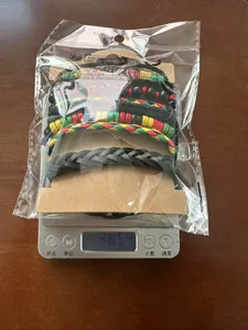 Close-up of 6-piece multilayer leather bracelet set on a digital scale weighing 38.54g