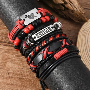 Multilayer leather bracelet set with LOVE charm and beads on a vintage display