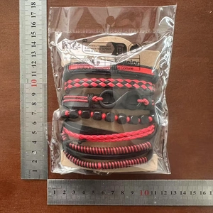 Detailed view of infinity leather bracelet set dimensions with metal rulers measuring scale