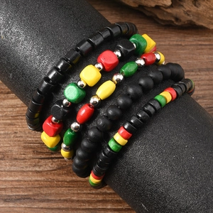 Handmade multi-layer Rasta wood bead bracelets in vibrant red, yellow, and green tones