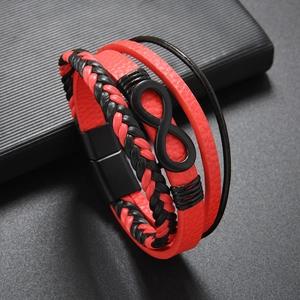 Close-up of red and black leather woven bracelet with infinity symbol and magnetic clasp