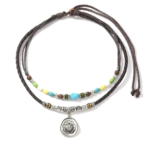 Close-up of bohemian double-layer woven necklace with colorful beads and sunflower pendant
