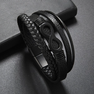 Detail of multi-layer leather bracelet with infinity symbol and black magnetic clasp