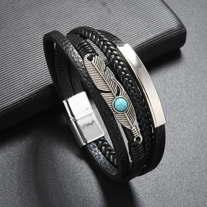Multilayer leather bracelet with vintage silver feather charm and turquoise bead detail