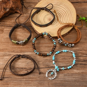 Bohemian multilayer bracelet set featuring wooden beads, bull head charm, and moon accents