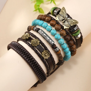 Bohemian multilayer bracelet set featuring turquoise beads, leather cord and bronze butterfly