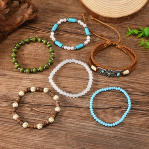 Bohemian multi-layer turquoise bead bracelet set with retro bull head charms on wood