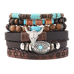 Detailed view of bohemian layered leather bracelet featuring bull skull and turquoise beads