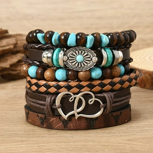 Close-up of bohemian leather wrap bracelet set with turquoise beads and bull head motif
