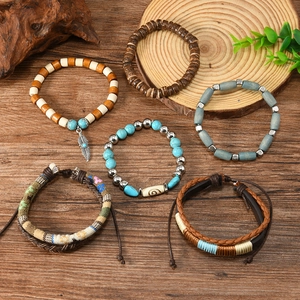 Detail of 6pcs bohemian multilayer bracelets with turquoise beads and feather charms