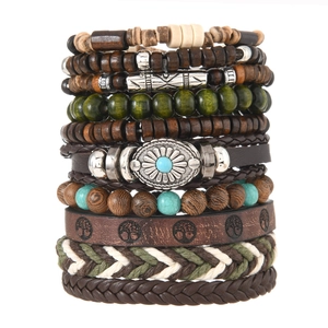 Macro detail of Bohemian multilayer bracelet set with Tree of Life and turquoise charms