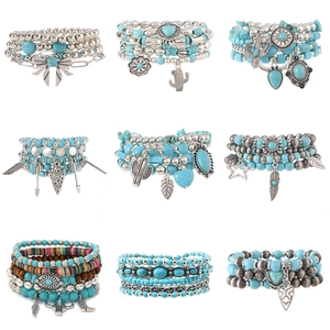 9-set Bohemian turquoise beads and wooden bracelets featuring ethnic charms on white