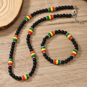 Bohemian black beaded necklace and bracelet set with red yellow green accent beads
