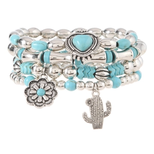 Detail of bohemian turquoise beaded bracelet set with heart and cactus charms