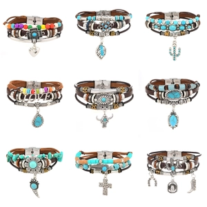 Bohemian multilayer leather bracelets set featuring turquoise beads and ethnic charms