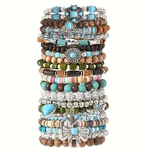 Set di 40 braccialetti bohémien multistrato con perline turchesi e ciondoli a farfalla