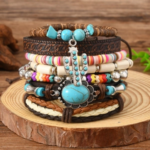 Detail of bohemian multilayer bracelet set with turquoise beads and cactus charm