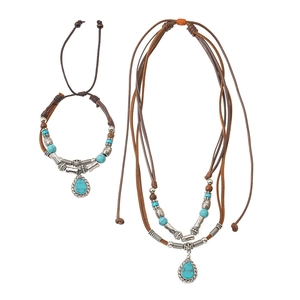 Detail of vintage layered woven necklace with blue turquoise heart pendant and alloy beads