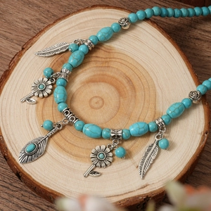 Sautoir bohème avec perles turquoise et pendentifs plumes en argent vintage