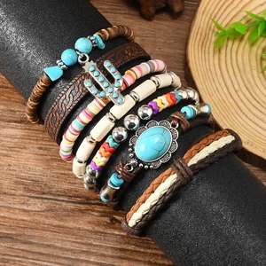 Detail of bohemian multilayer beads with turquoise stone and cactus charm on display