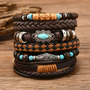 Macro detail of multi-layer bohemian leather bracelet with ethnic beads and bull head motif