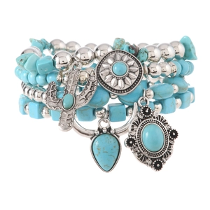 Detail of multi-layer Bohemian beaded bracelet set with turquoise stones and silver charms
