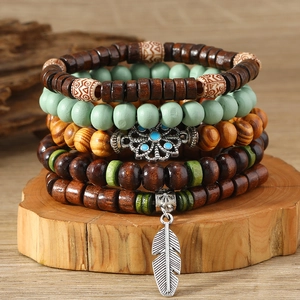 Five-piece bohemian men's stackable wooden bead bracelets with a silver feather pendant