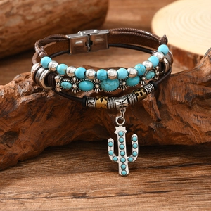 Detail of multi-layer leather bracelet with turquoise beads and cactus pendant charm