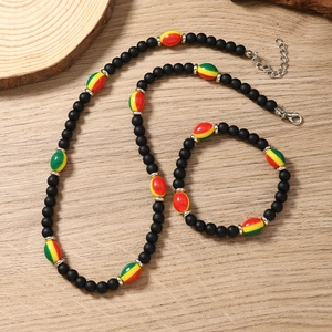 Handmade Rasta color beaded necklace and bracelet set with black matte beads for women