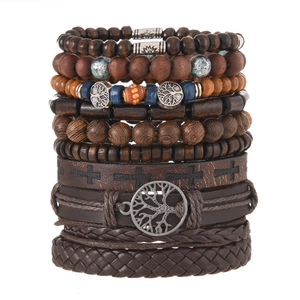 Detail of multi-layer leather bracelets set with Tree of Life and wooden beads charms