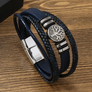 Men's multilayer leather tree of life bracelet with silver magnetic clasp on wood
