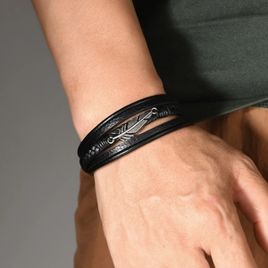 Men's multilayer black braided leather bracelet with silver feather charm and magnetic clasp