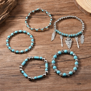 Detailed set of 5 Bohemian stretch bracelets with turquoise beads and feather pendants