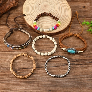 Detailed flat lay of bohemian leather beaded bracelet set with turquoise accents