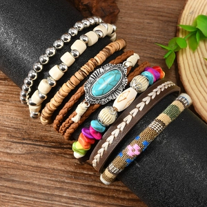Close-up of Bohemian multilayer bracelets with turquoise and beads on a display stand