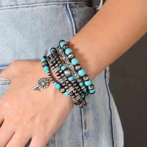 Bohemian multilayer turquoise bead bracelet set with silver floral charms and ethnic motifs