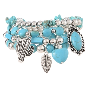 Detail of Bohemian beaded bracelet set with cactus, leaf charms and turquoise stones