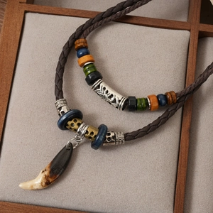 Ethnic double-layer braided necklace with multicolored beads and wolf tooth pendant