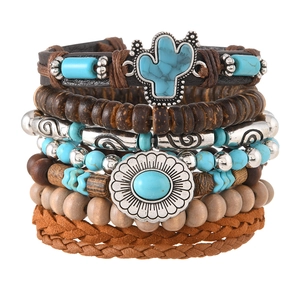 Detail of bohemian multilayer bracelet set with wood beads and leather straps