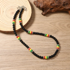 Detail view of Bohemian beaded necklace with matte black beads and colorful accents