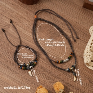 Detailed view of bohemian double-layer woven wolf tooth necklace with vintage beads