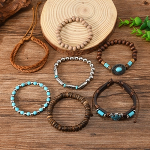 Detailed set of 7 bohemian bracelets with wood beads, leather cords and turquoise charms
