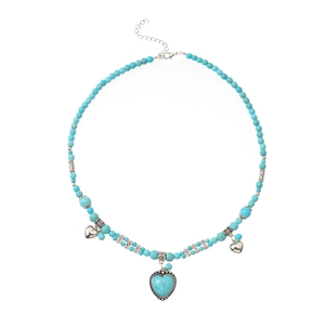 Collier bohème avec perles turquoise, pendentifs cœurs argentés et chaîne ajustable